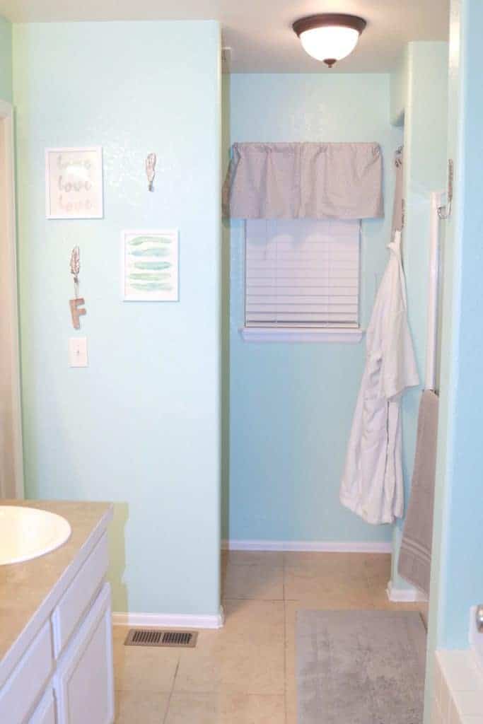 master bathroom makeover, wood wall behind toilet, grey and aqua bathroom, affordable bathroom makeover, bathroom makeover on a budget, budget friendly bathroom makeover, how to paint cabinets, how to use frogtape®