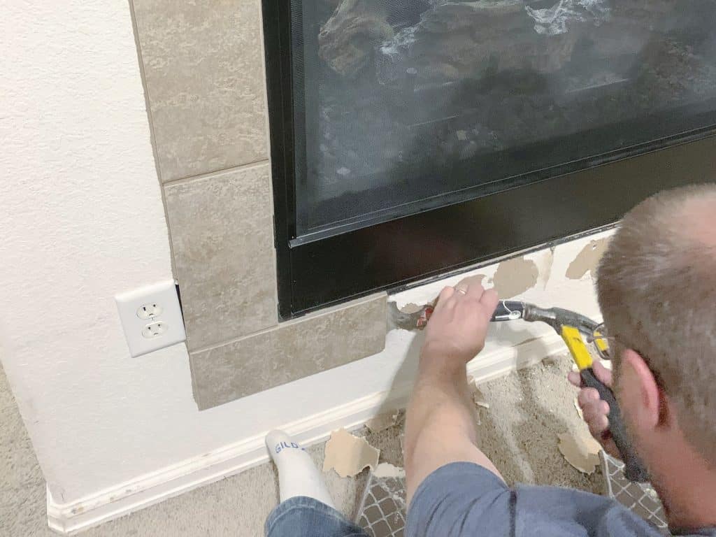 Removing tile around fireplace